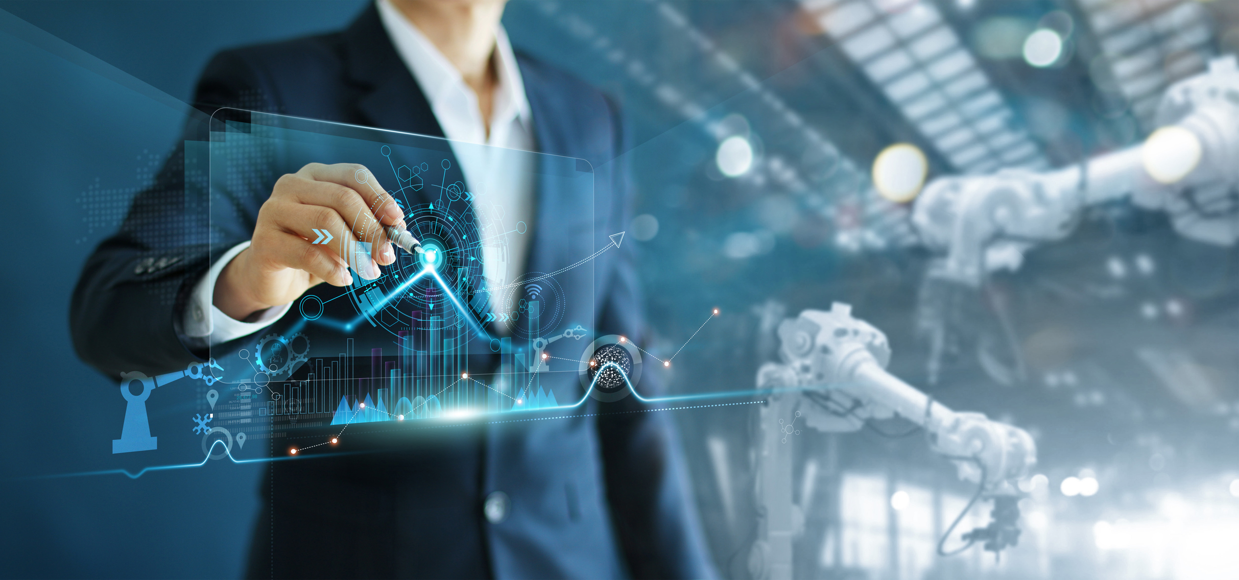 Manager engineer analyzing and control automation robot arms machine on software modern virtual interface data real time in intelligent factory industrial and digital manufacturing operation. Hologic Creates Strategic Advantage with Procurement Solution